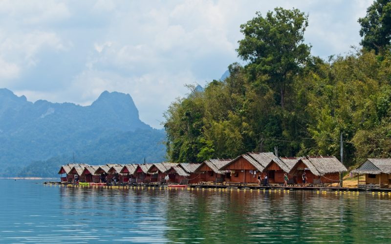 A beautiful view of the wooden huts over the ocean captured in Thailand