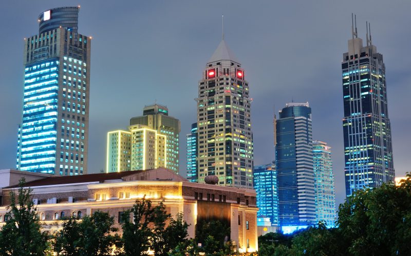 Shanghai at night with urban skyscrapers and lights